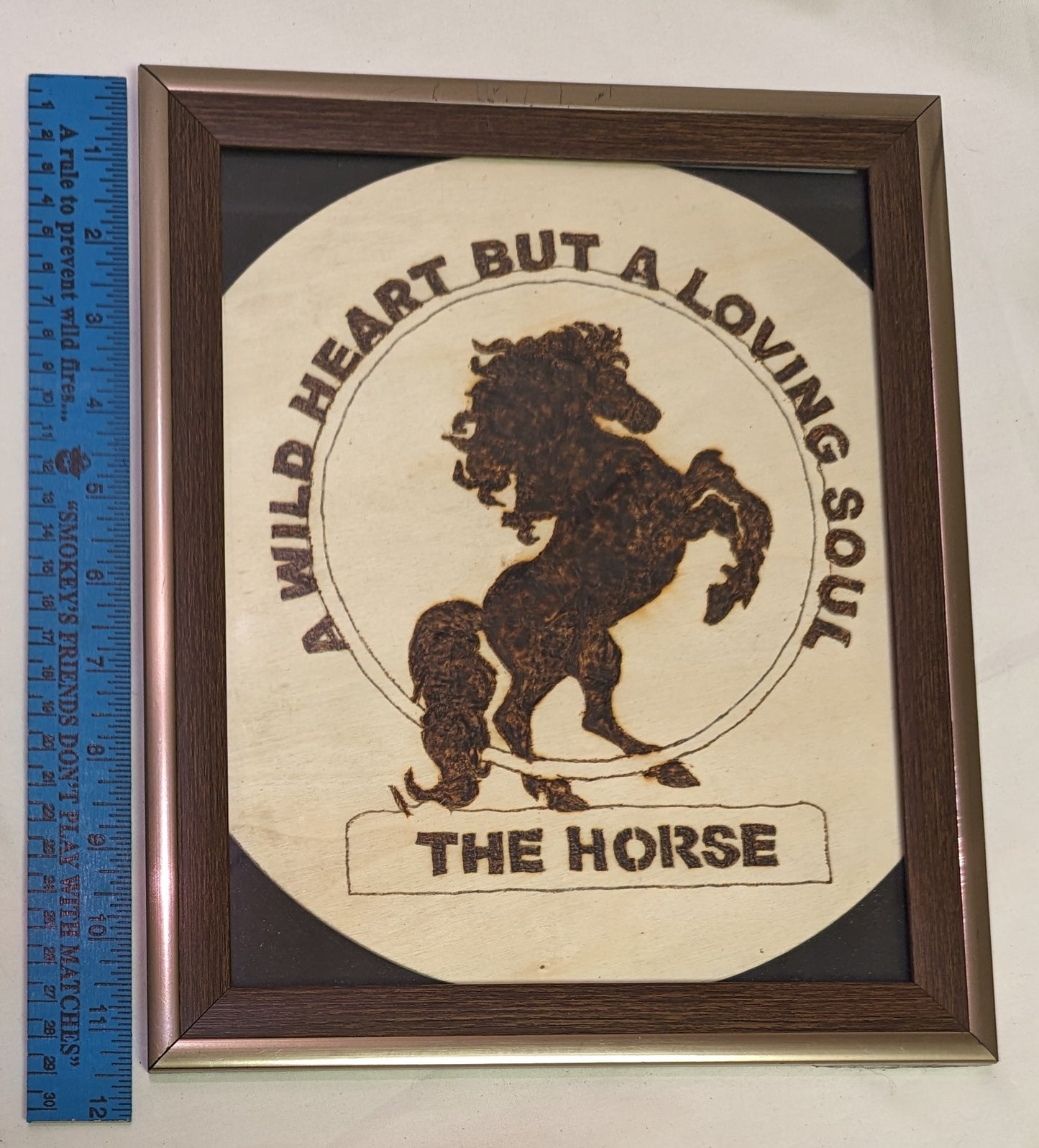 Art Pyrography Sign on round wood " The Horse" A Wold Heart But a Loving Soul in frame under glass