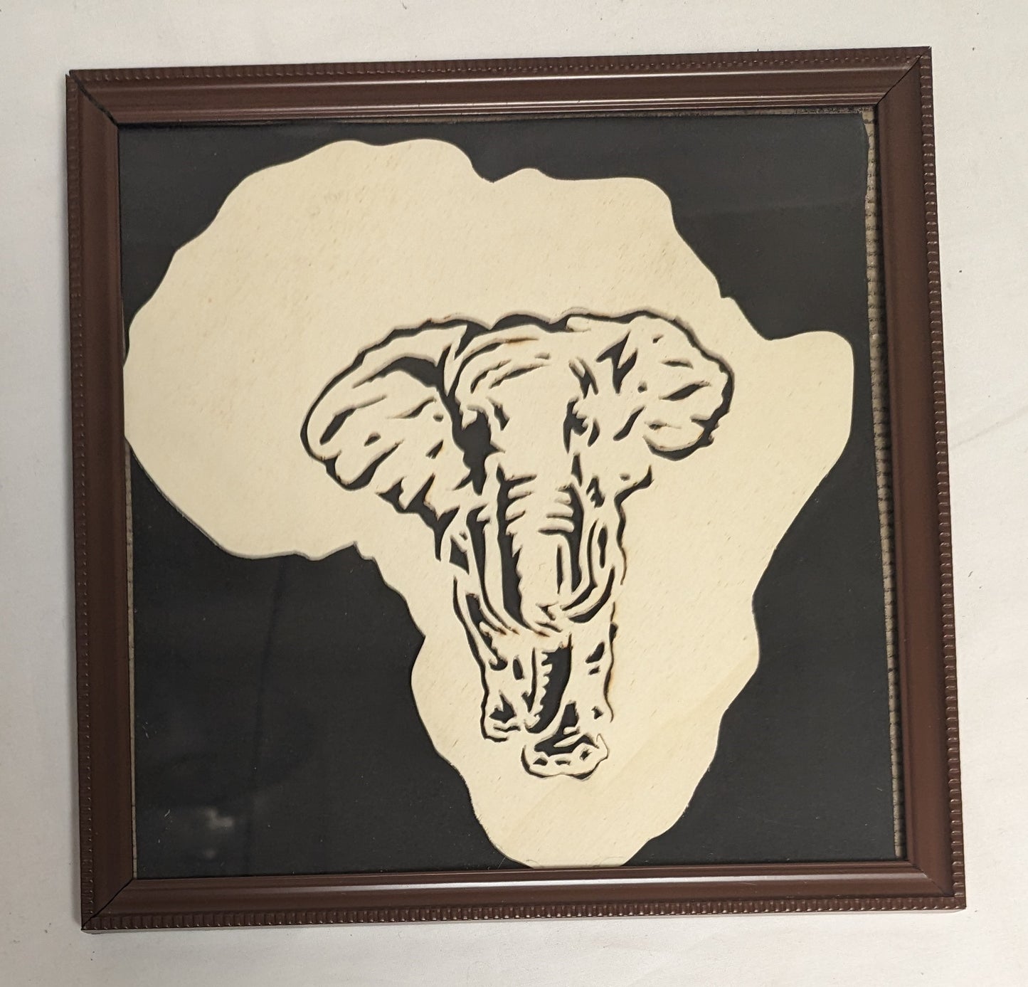 Art Hand Scroll Sawn African Elephant" in frame under glass Credited and Autographed