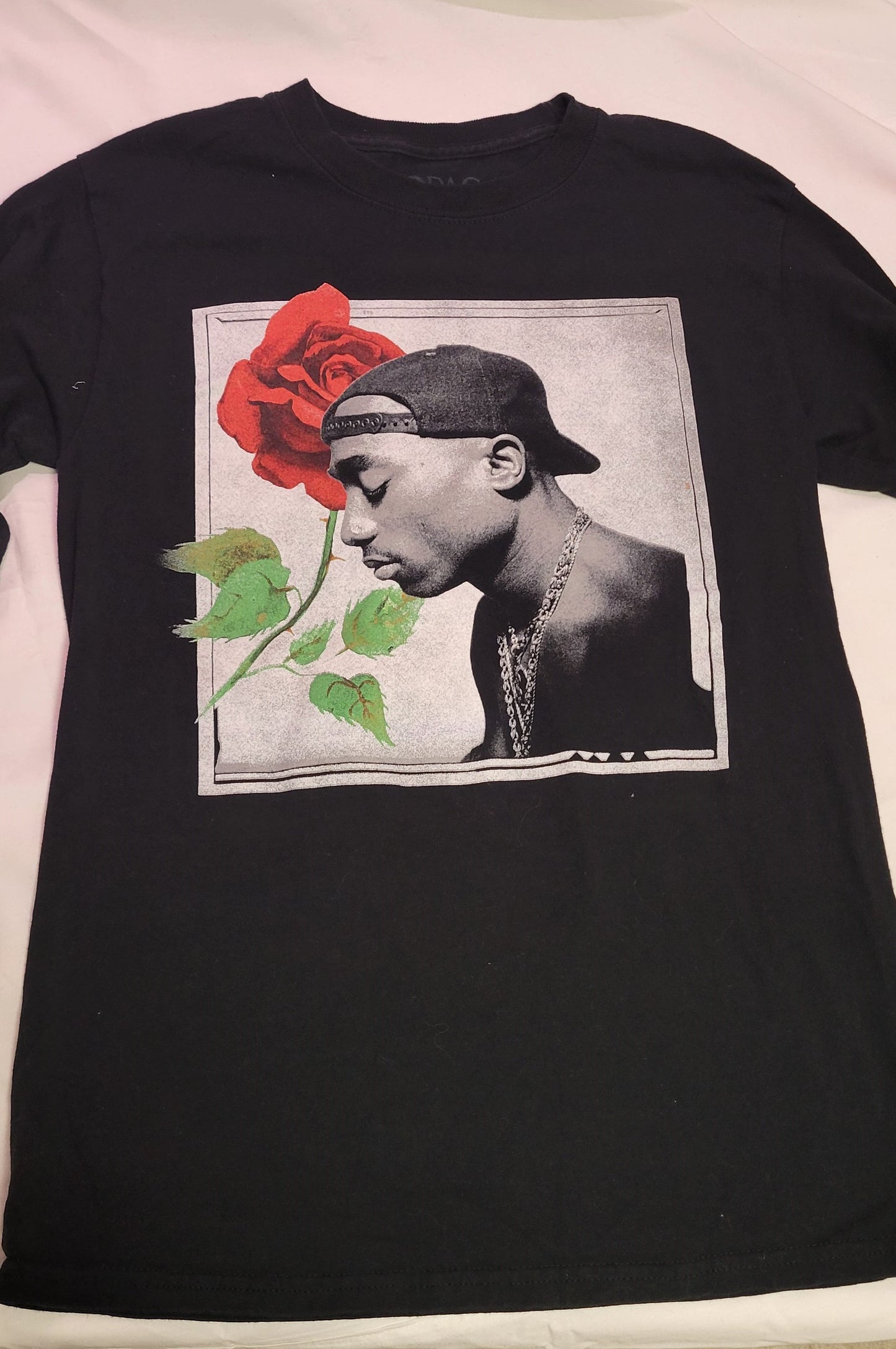 TShirt Long Sleeve Tupac with Rose Tupac printed on one arm. Size Medium