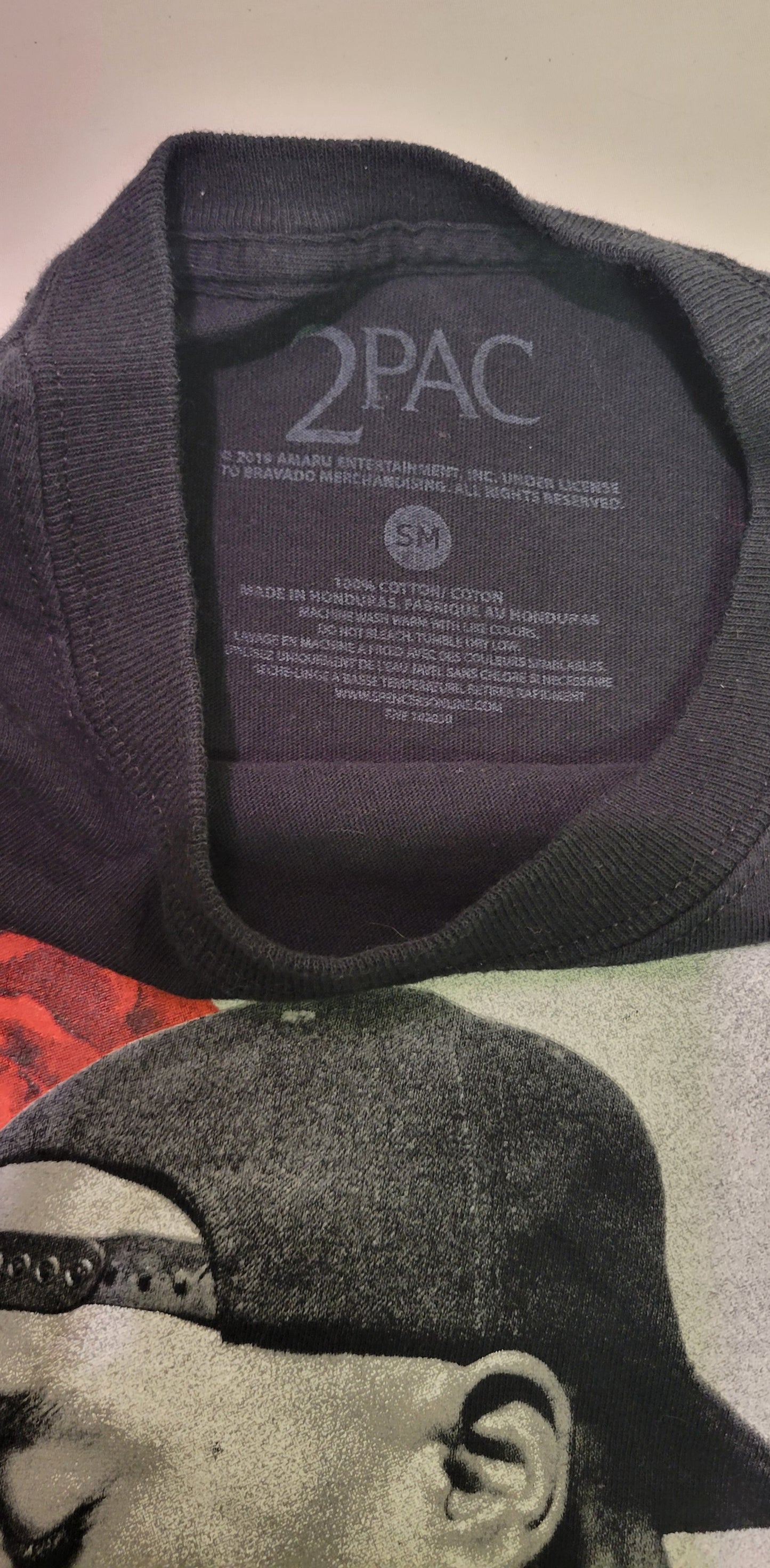 TShirt Long Sleeve Tupac with Rose Tupac printed on one arm. Size Medium