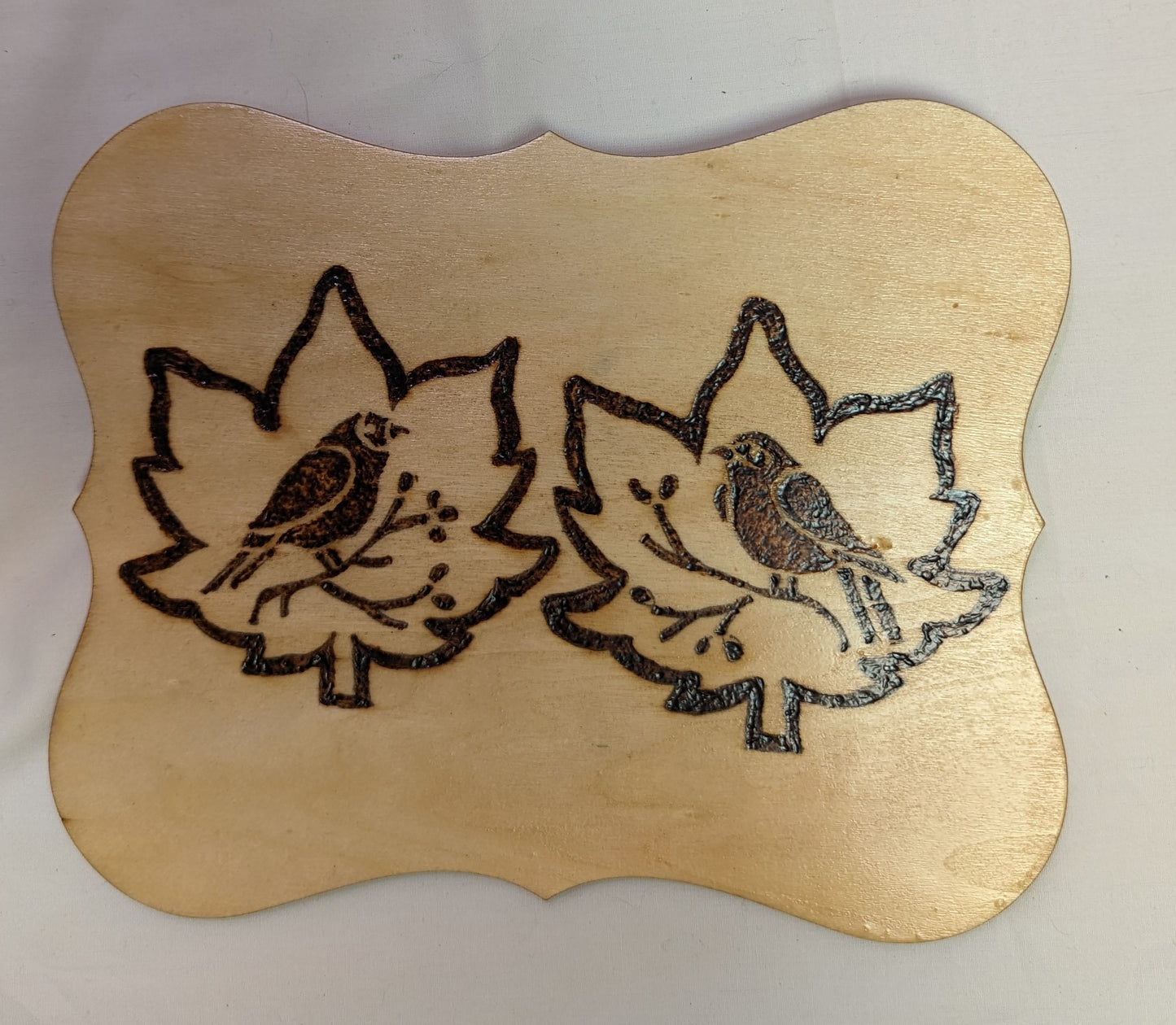 Art Pyrography Two Birds Emblem on Leaves Burned in Wood