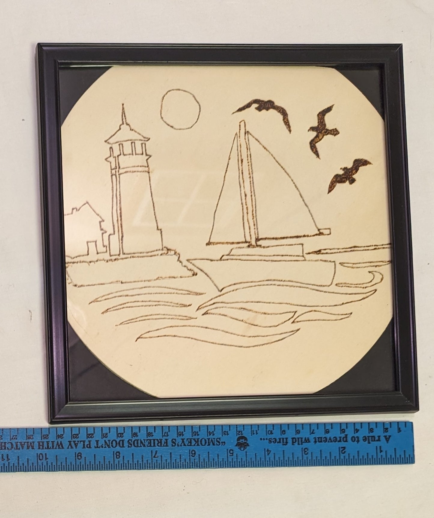 Art Pyrography Hand Burned on Wood Sailboat and lighthouse under glass in frame