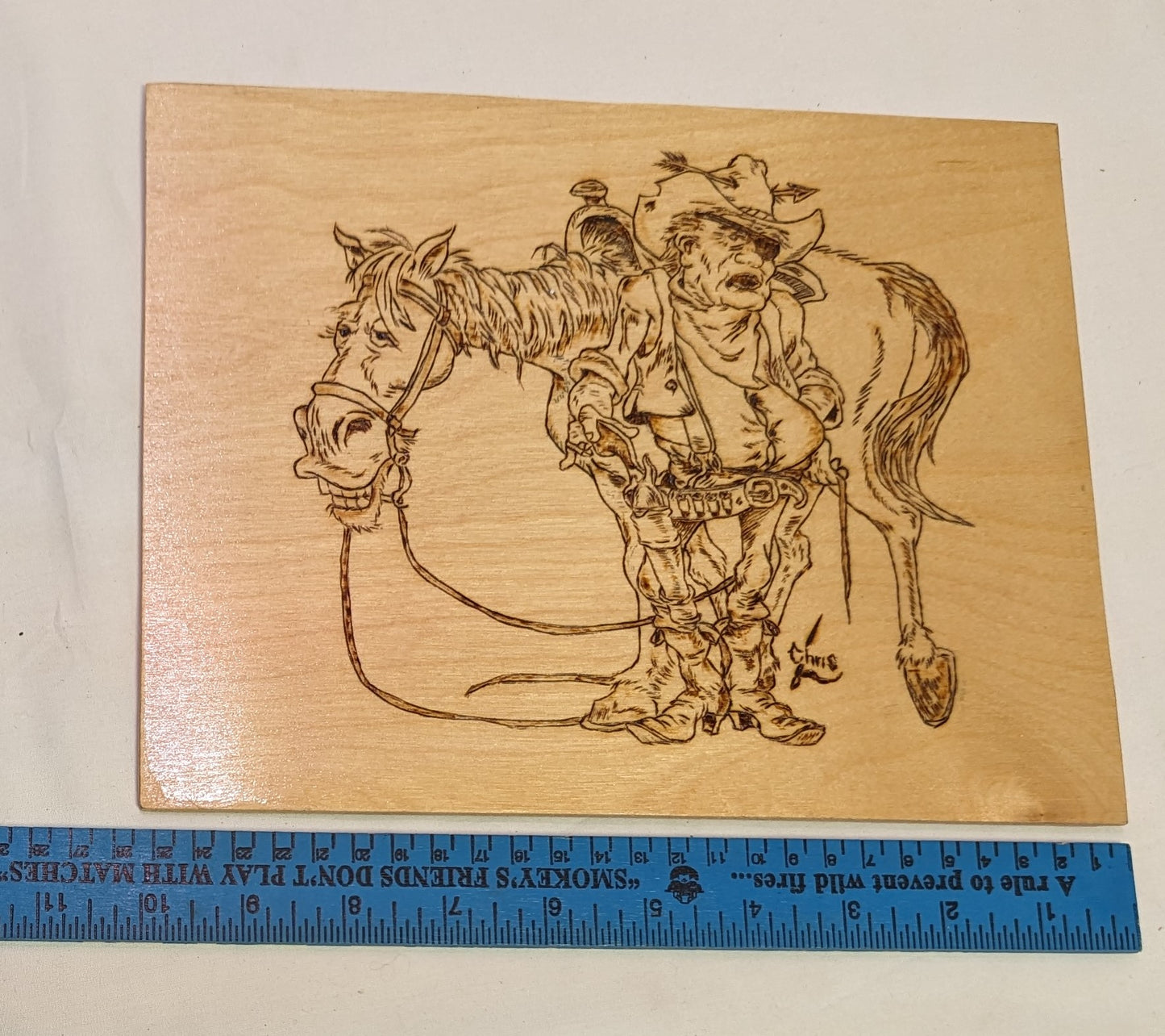 Art Pyrography of a Nate Owens Caricature of John Wayne in True Grit burned on Wood