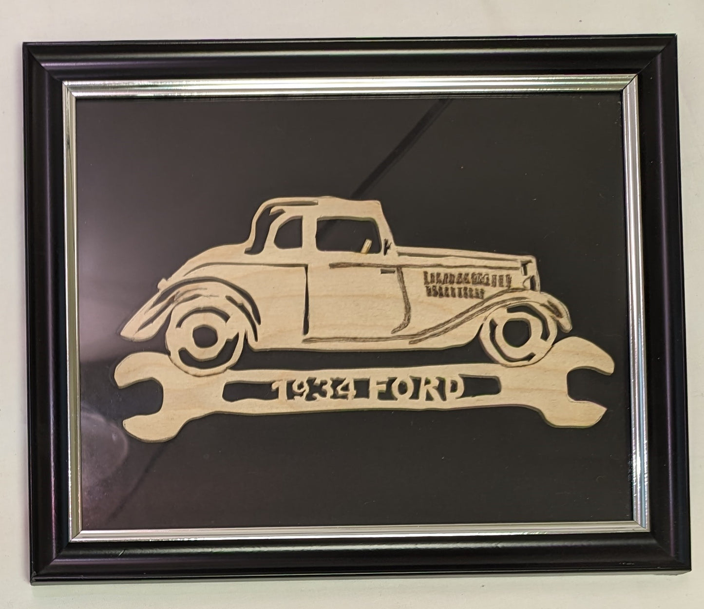 Art Scroll Sawed Wood Cut Out 1934 Ford Car and Wrench Emblem in frame under Glass