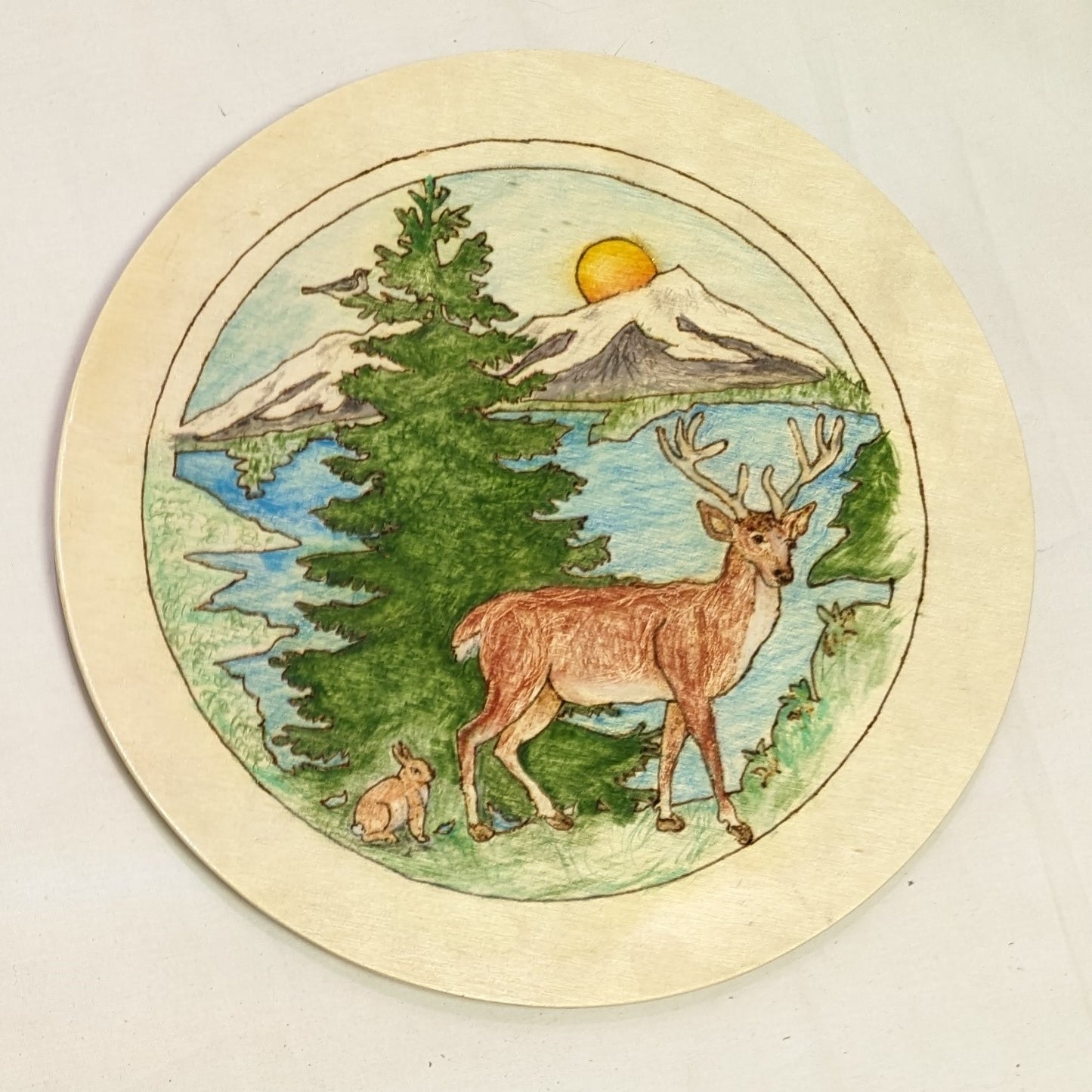 Art Pyrography painted filled on round wood. Buck and Bunny Mountain Scene