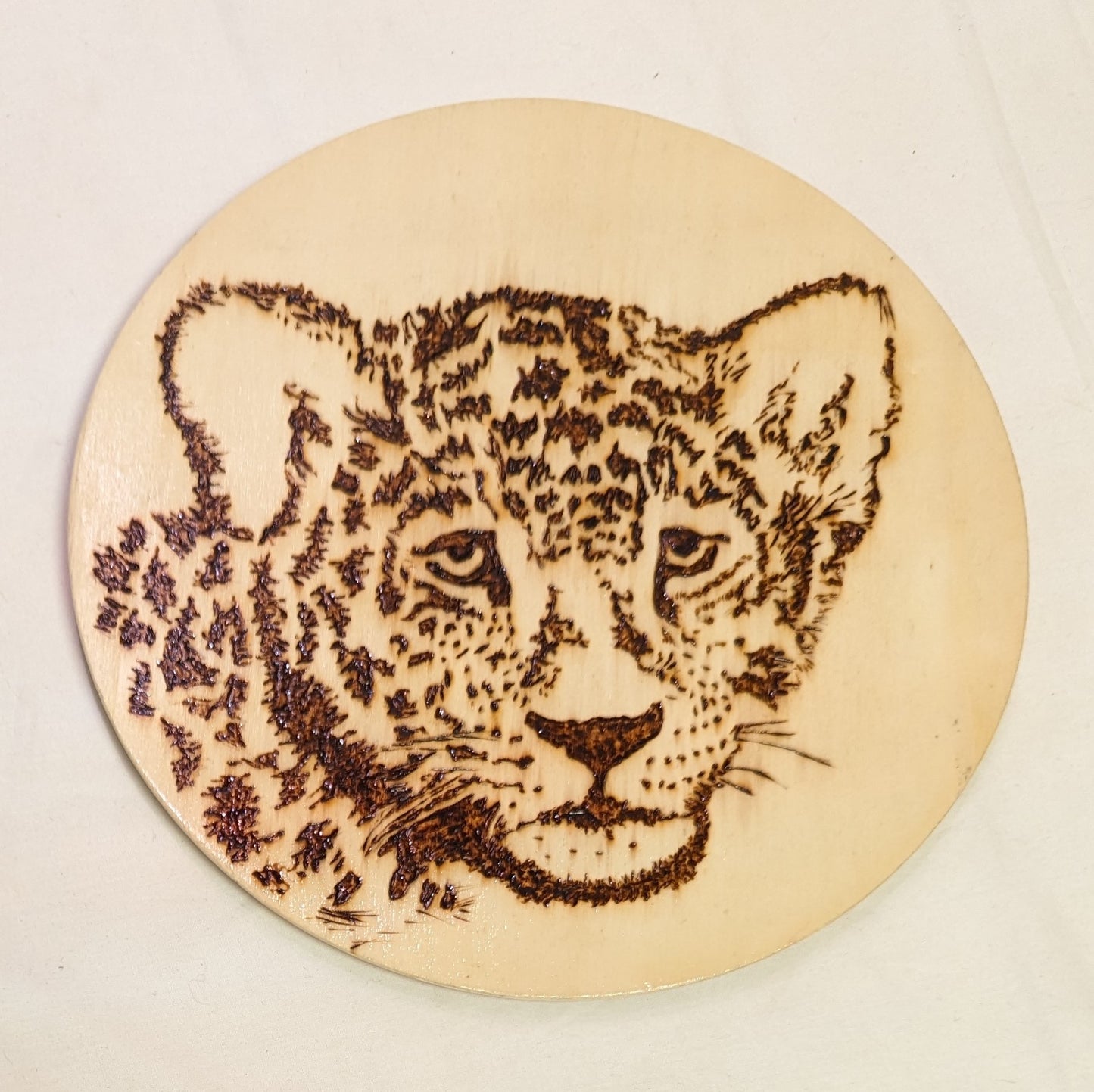 Art Pyrography on round plywood" Leopard Face" Original Artist Acredited.