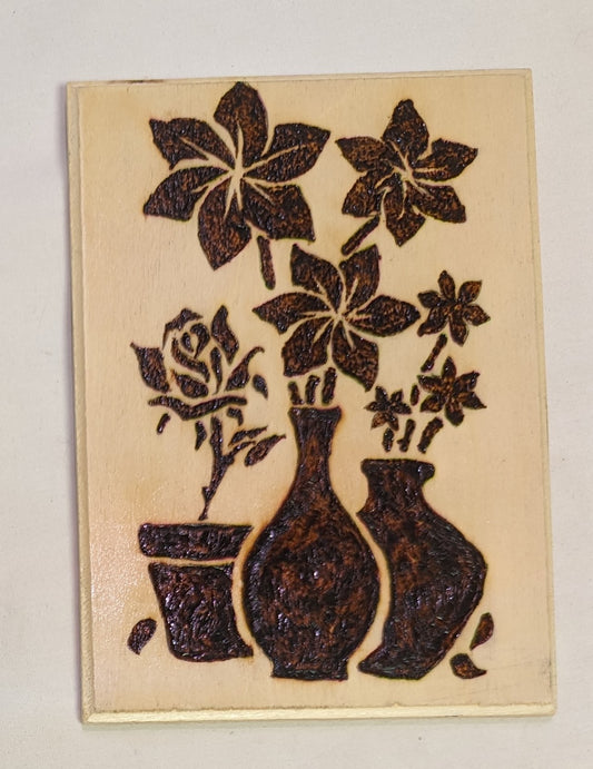 Art Pyrography on wood Flowers in pots emblem negative style