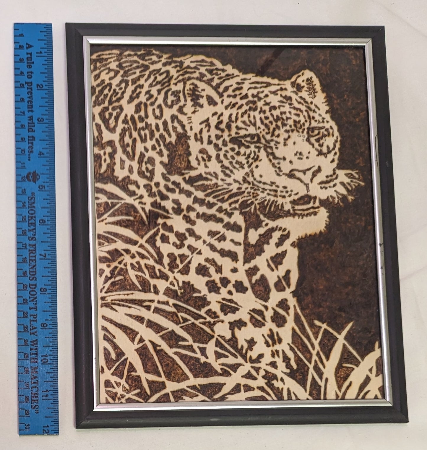 Art Pyrography on wood " Stalking Leopard" in frame under glass