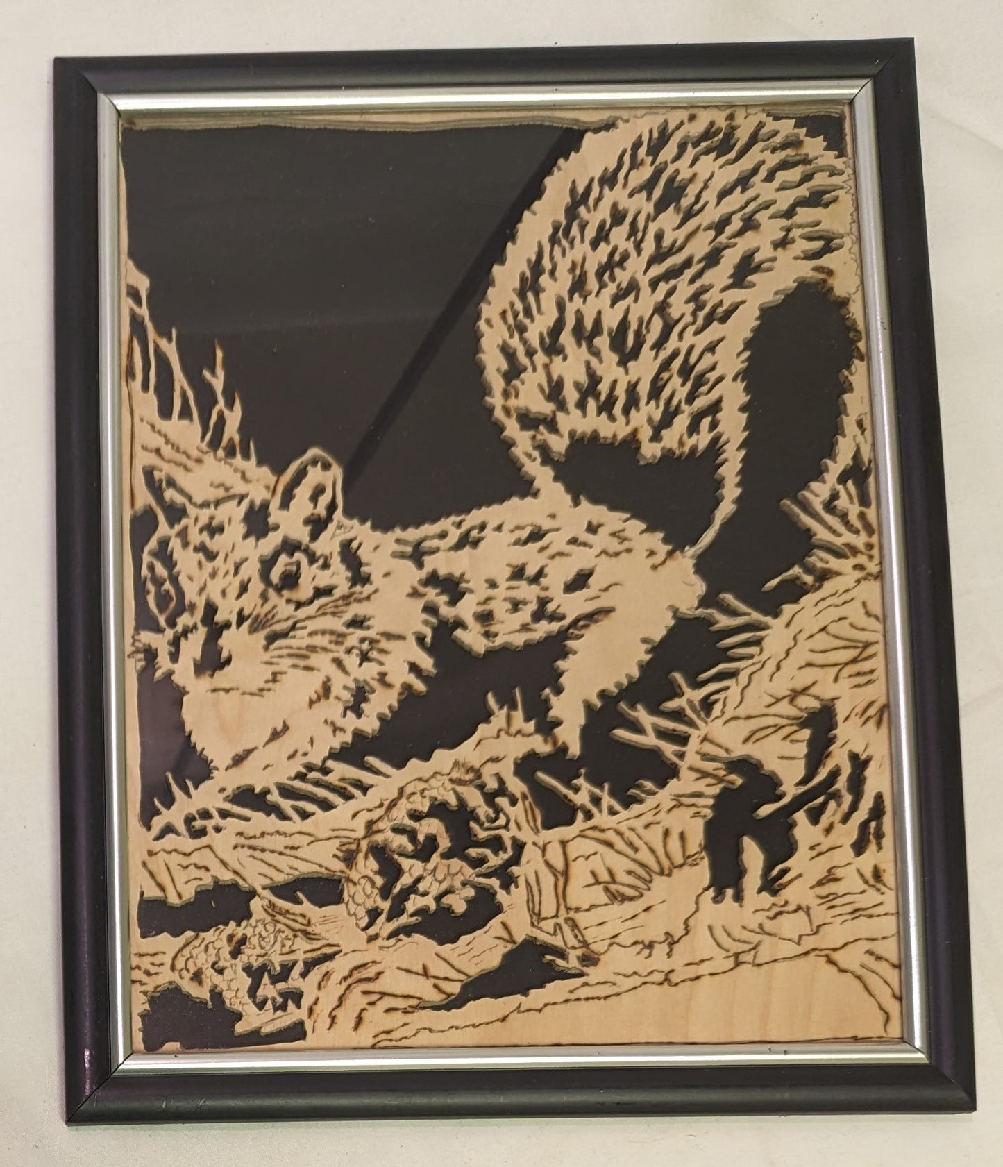 Art scroll saw from wood Squirrels Nest" in frame under glass