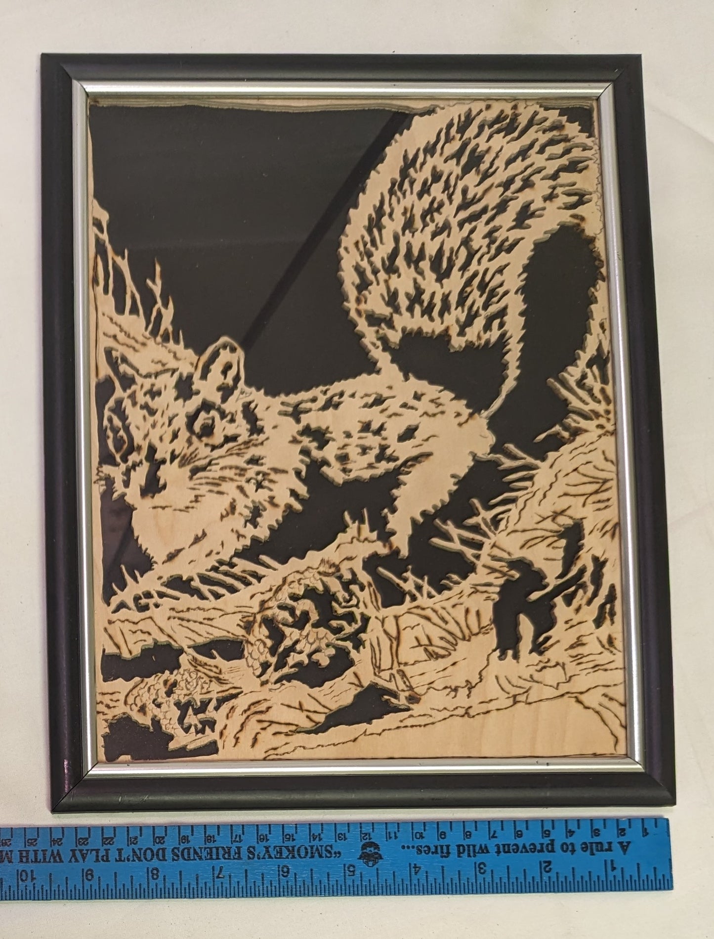 Art scroll saw from wood Squirrels Nest" in frame under glass