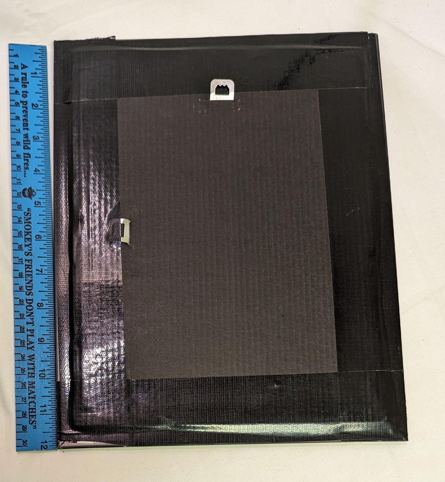 Art scroll saw from wood Squirrels Nest" in frame under glass