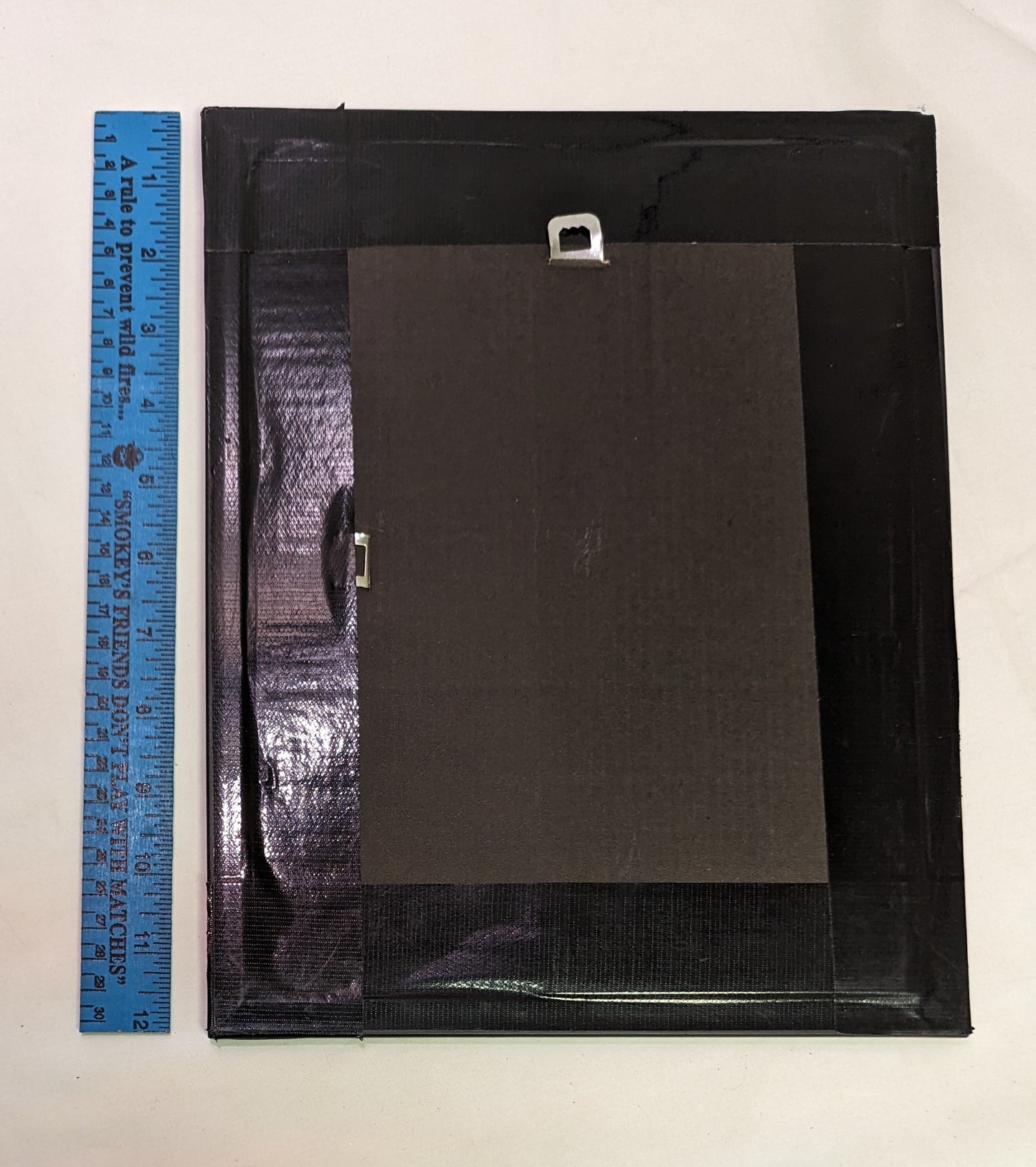 Art Scroll saw cut out negative . Snarling Leopard in frame under glass