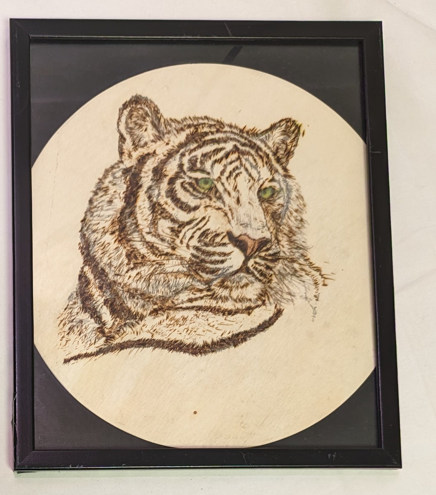 Art Pyrography on round wood "Tiger green eyes" in frame under glass