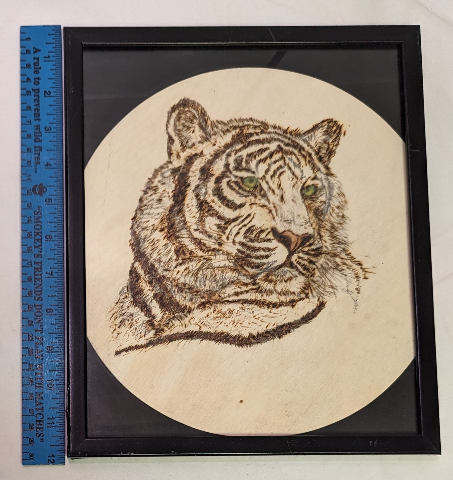 Art Pyrography on round wood "Tiger green eyes" in frame under glass