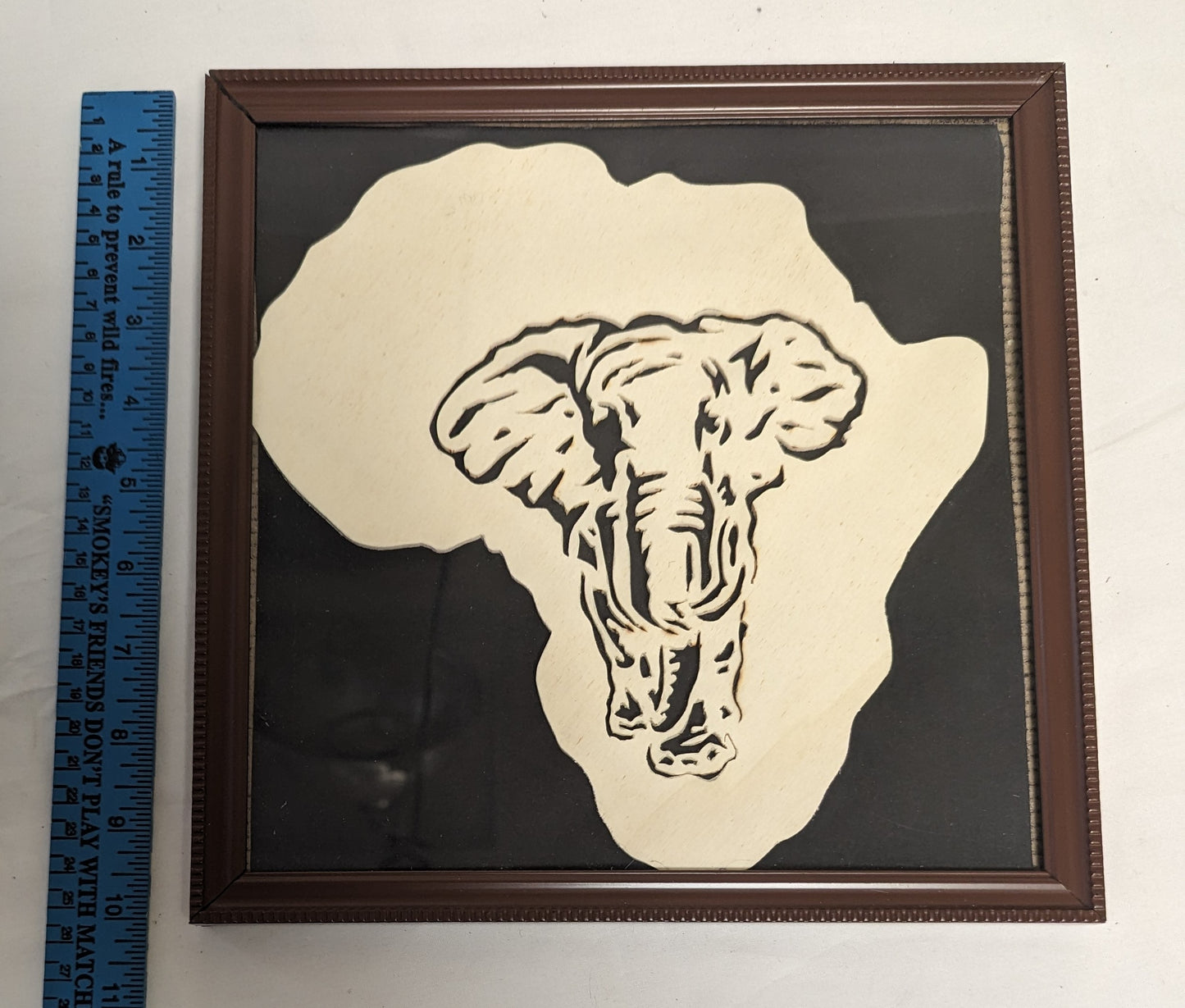 Art Hand Scroll Sawn African Elephant" in frame under glass  Credited and Autographed