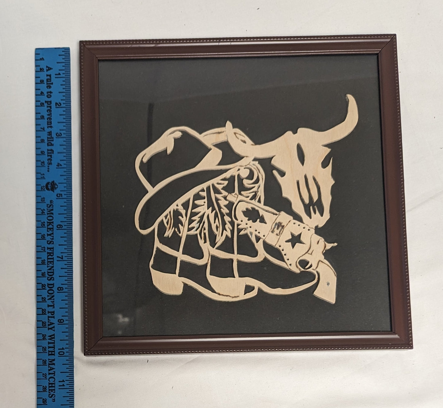Art Hand Scroll Sawn Delicate "Cowboy Emblem" in frame under glass