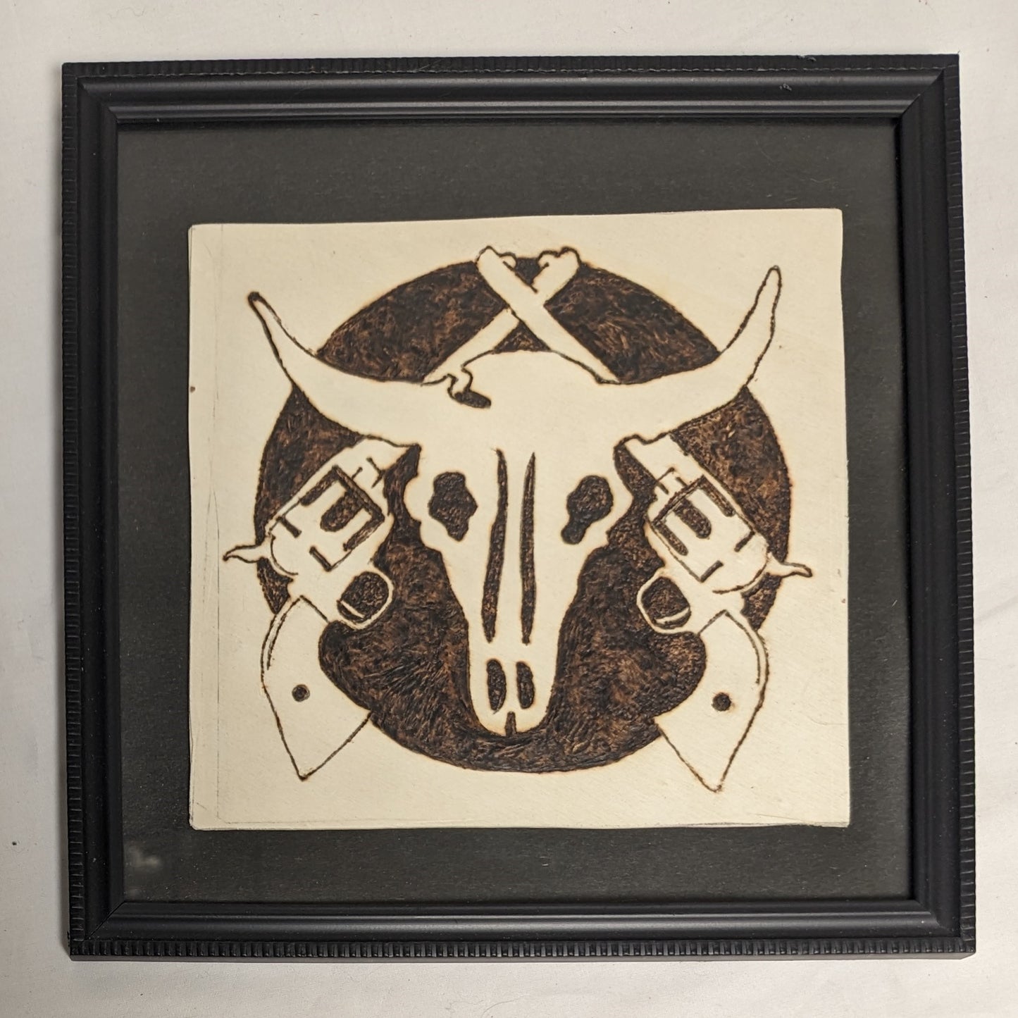 Art Handmade Pyrography on wood  " Skull and Cross Pistols"  in frame under glass