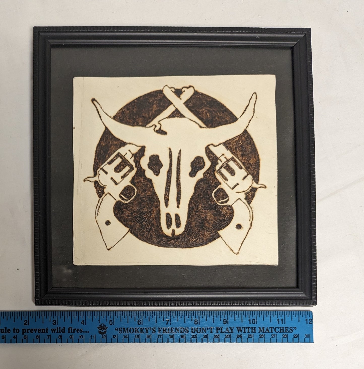 Art Handmade Pyrography on wood  " Skull and Cross Pistols"  in frame under glass