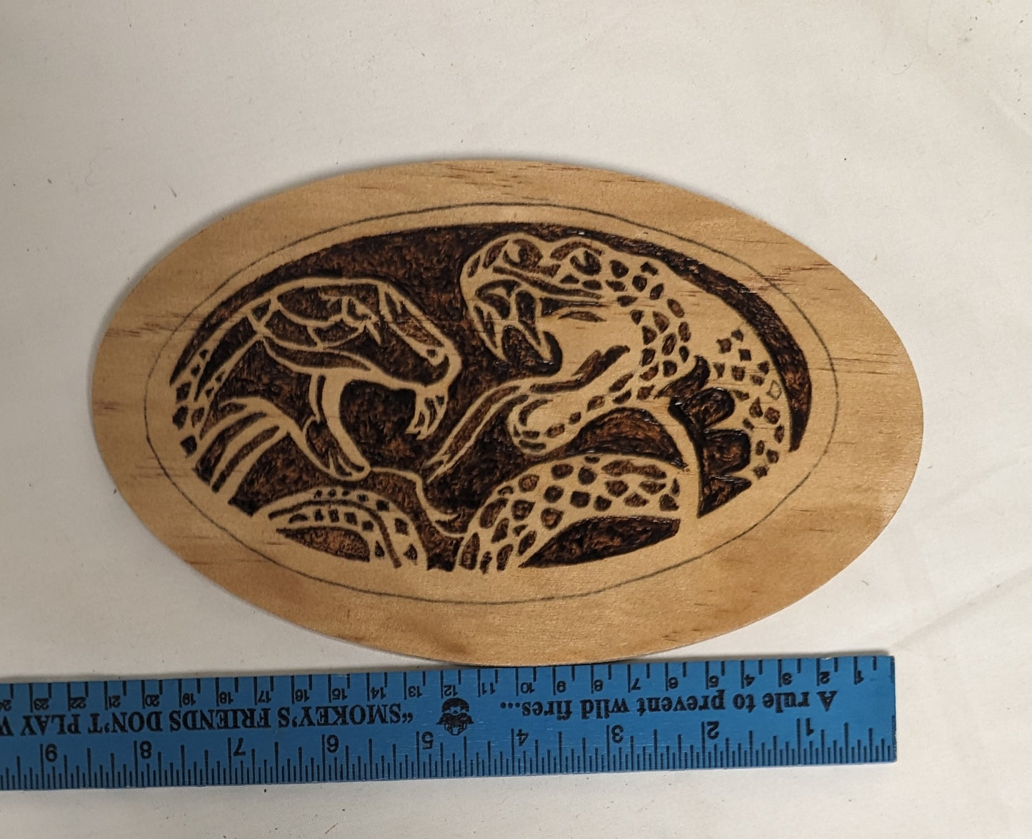 Art Handmade scroll sawn Pyrography on wood Emblem " Boots and Pistols"  wall hanging